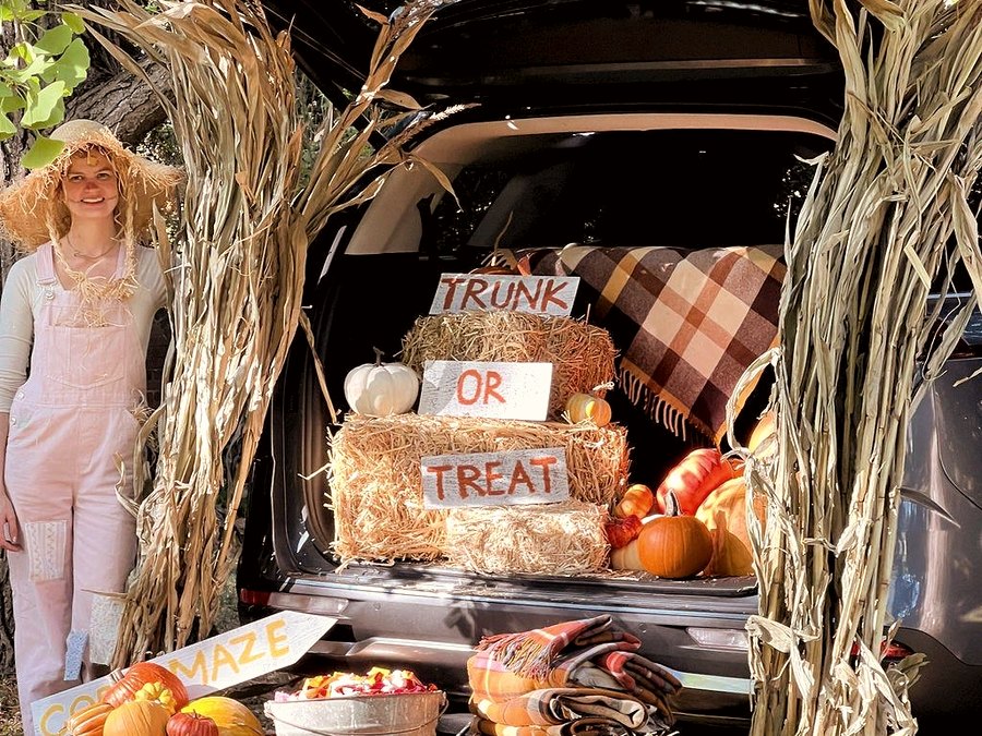 Fall Festival themed trunk with hay bales, pumpkins, and corn stalks