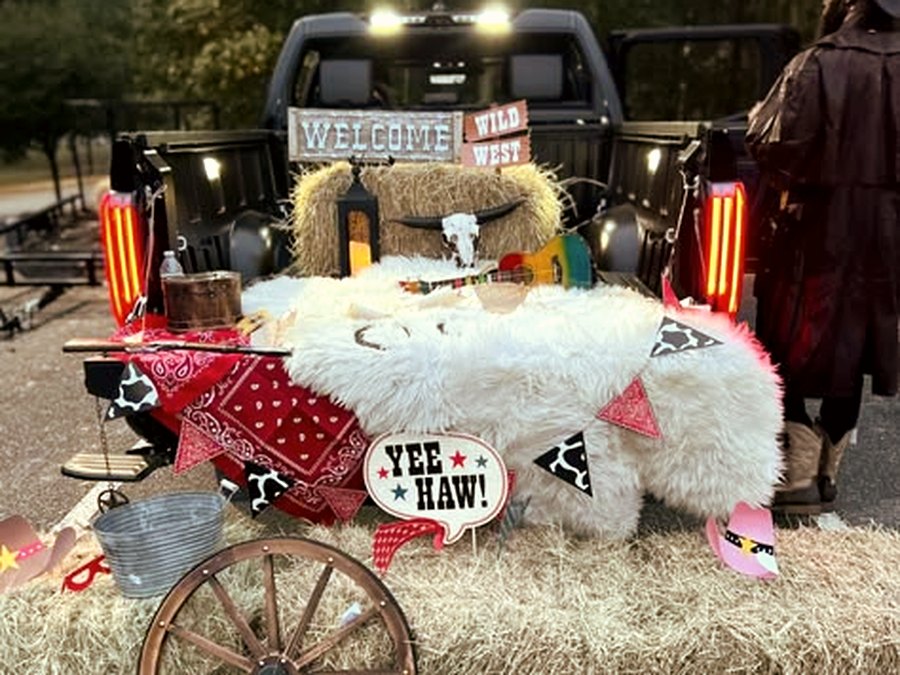 Western Roundup themed trunk with hay bales and Yee Haw sign